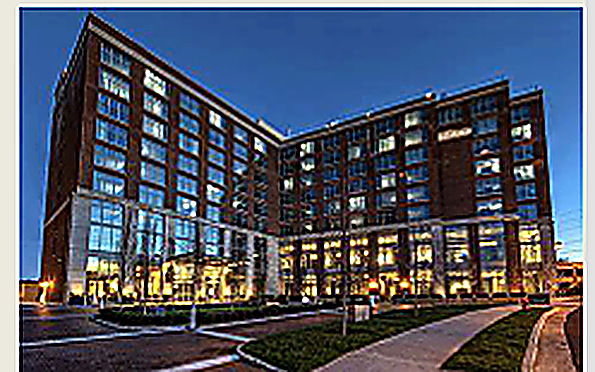 Hotel exterior illuminated at dusk