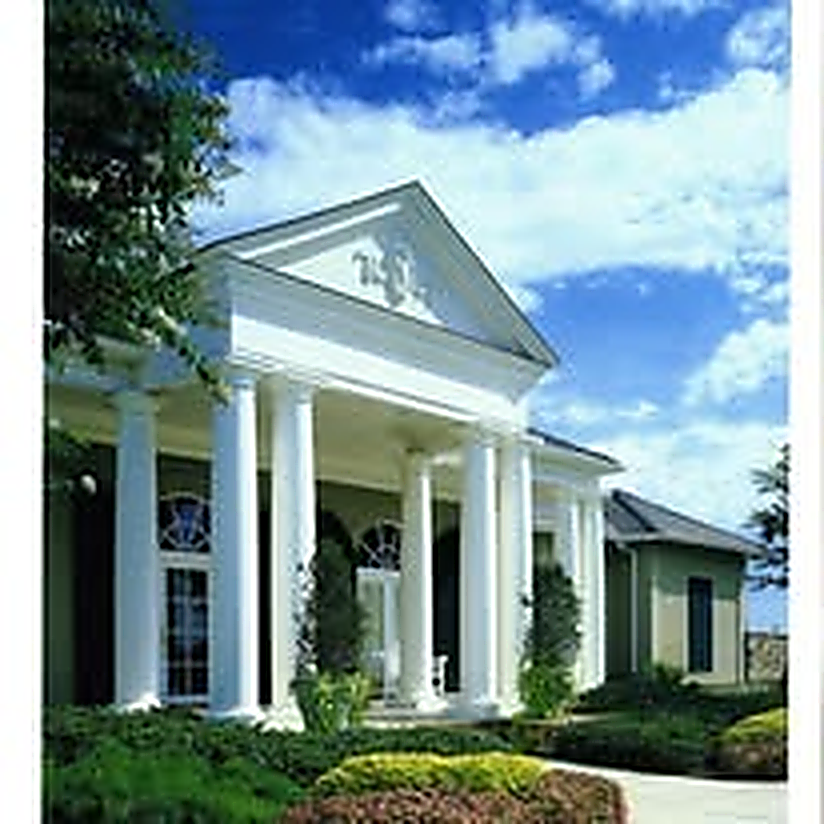 Classical white-columned portico entry to a resort clubhouse