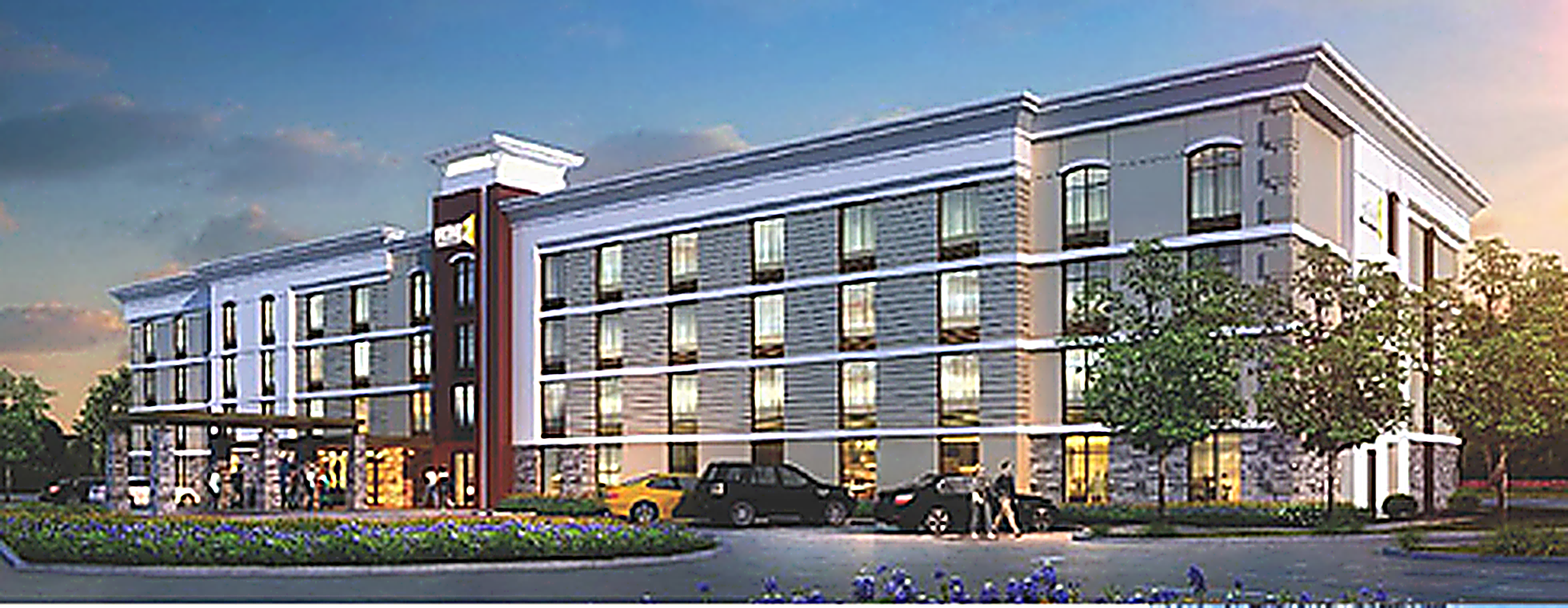 Home2 Suites limited service hotel exterior at dusk