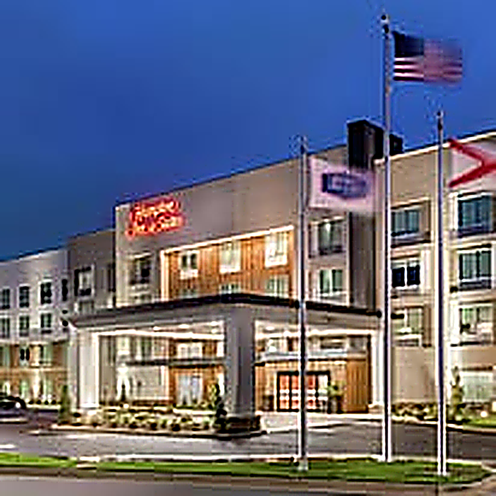 Hampton Inn & Suites exterior at dusk