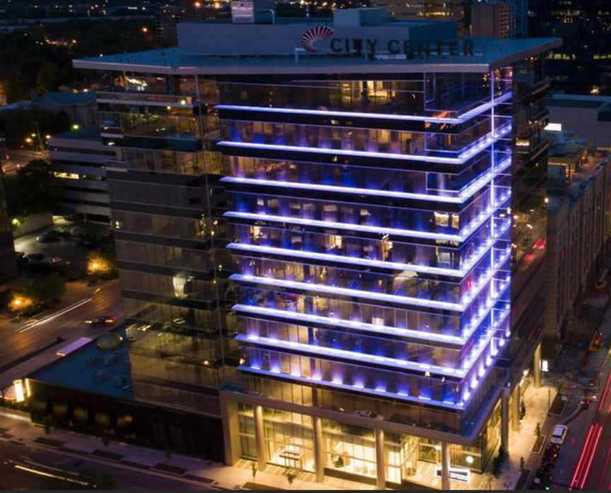 City Center mixed-use tower illuminated in blue at night
