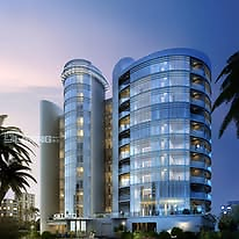Twin coastal residential towers at twilight